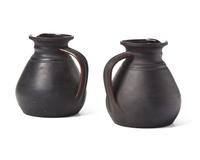 A Pair of Wedgwood Black Basalt "Golf Girls" Decorated Kenlockware Jugs