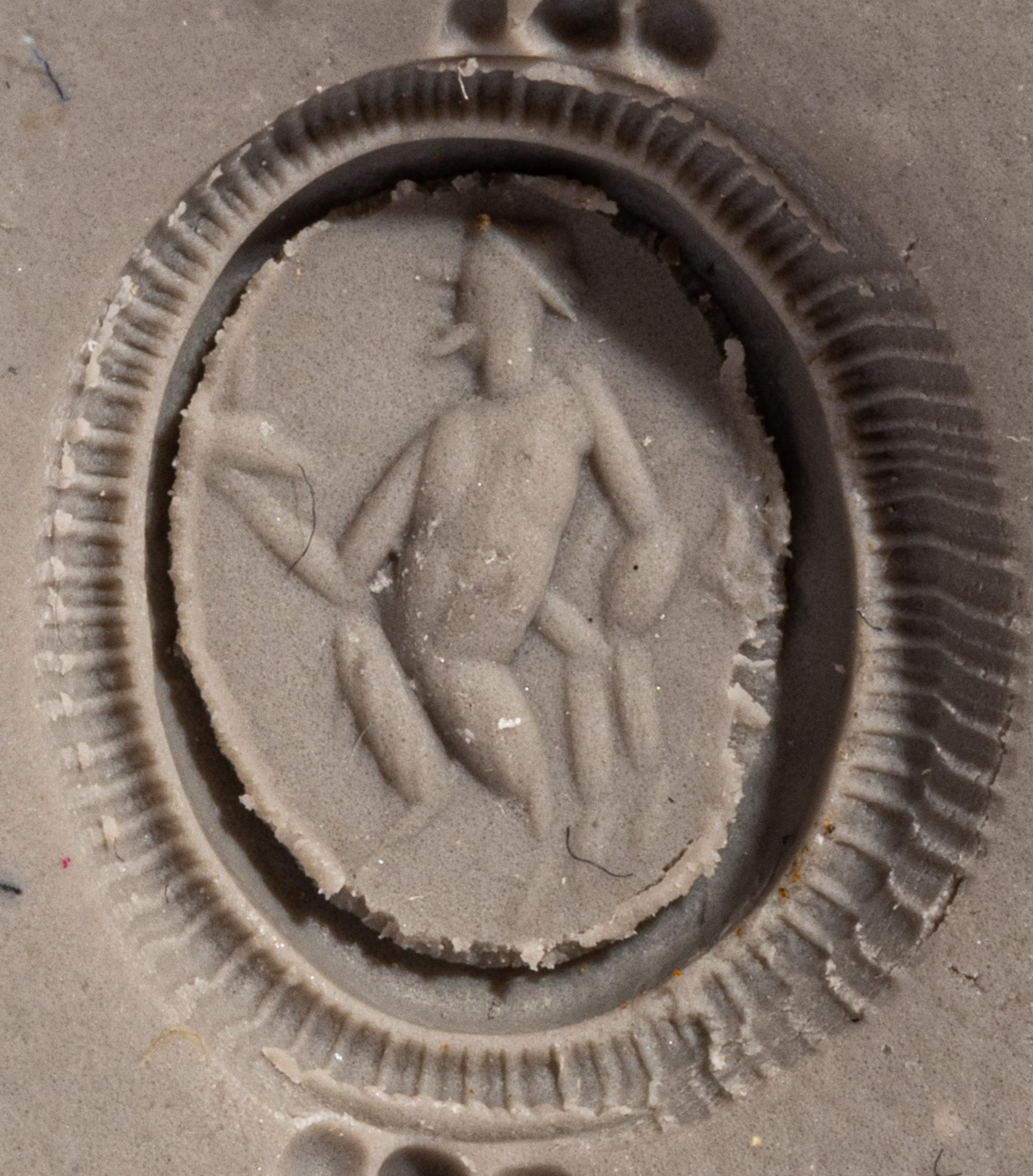A Roman Gold and Jasper Finger Ring with a Dancing Satyr