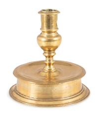 A Continental Cast Brass Capstan Candlestick