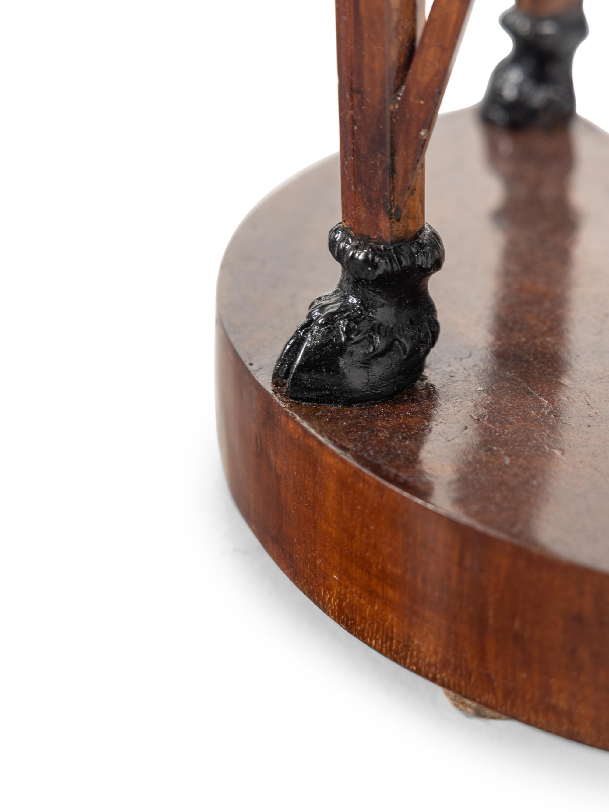 A Pair of Italian Neoclassical Part-Ebonized Walnut Demilune Tables