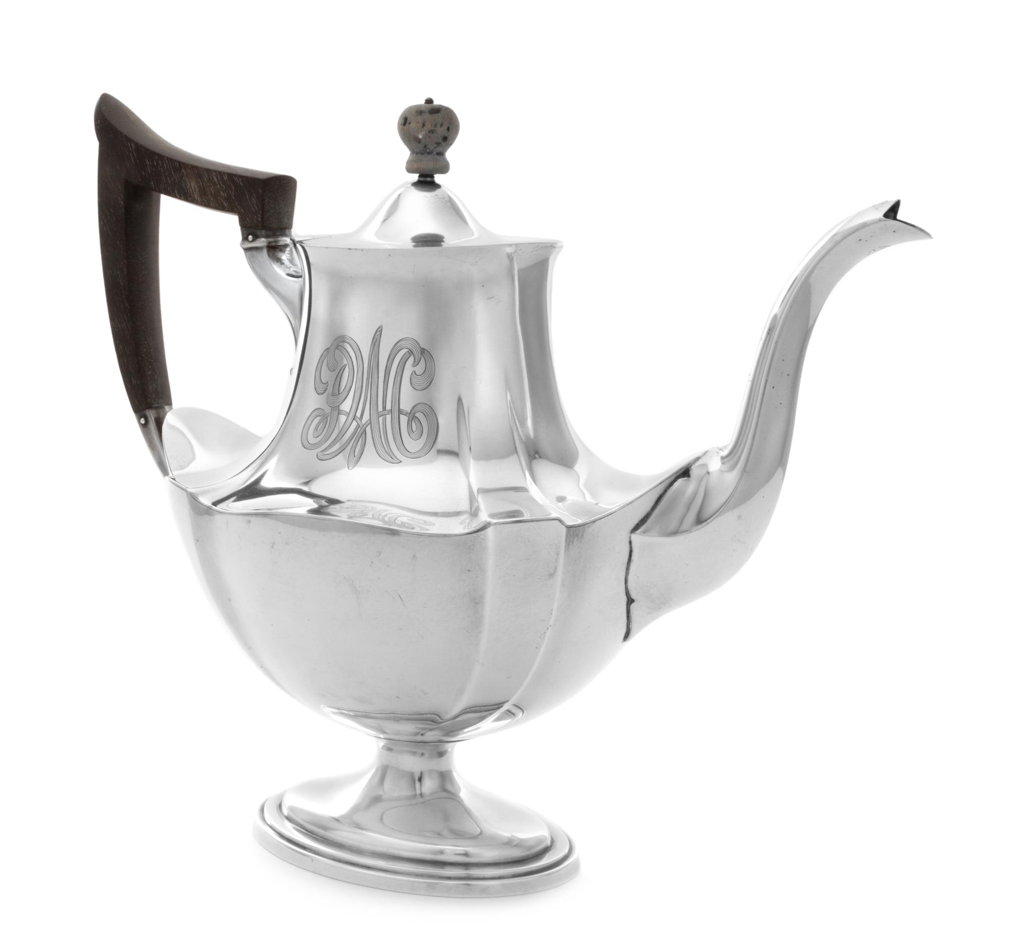 An American Silver Teapot, Gorham Mfg. Co., Providence, RI, 1906, of baluster handled form, the neck worked with an engraved monogram.