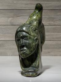 stone sculpture, woman and seal