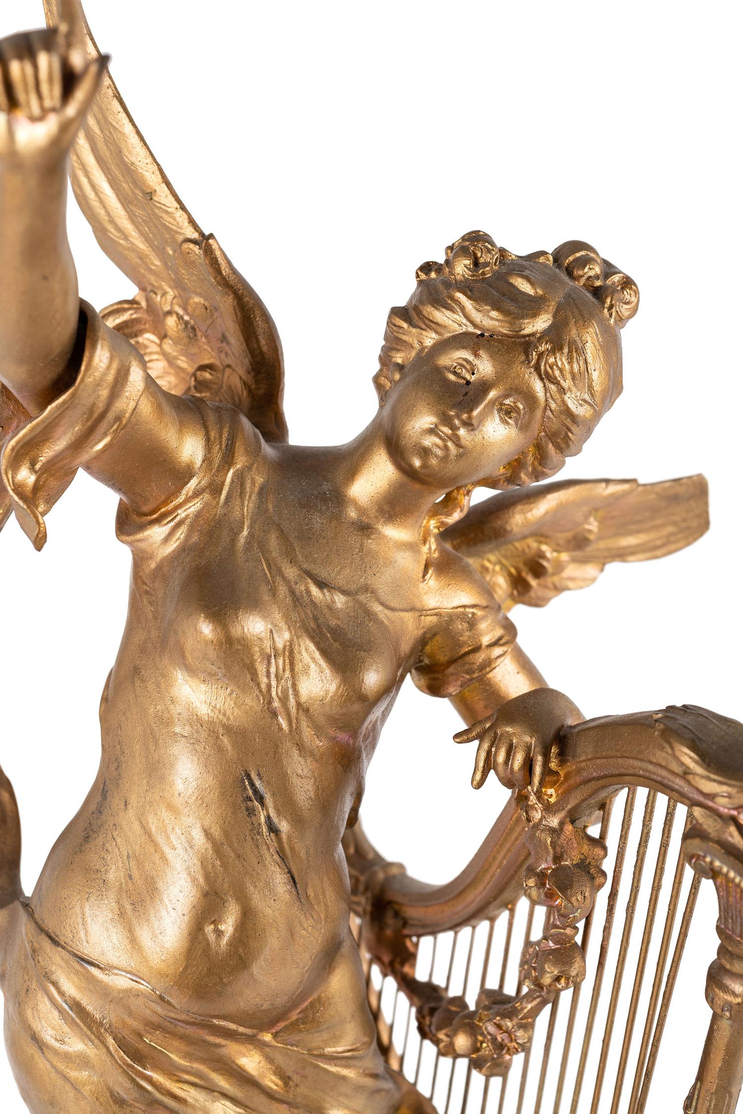 A Neoclassical Gilt Metal and Onyx Clock Garniture