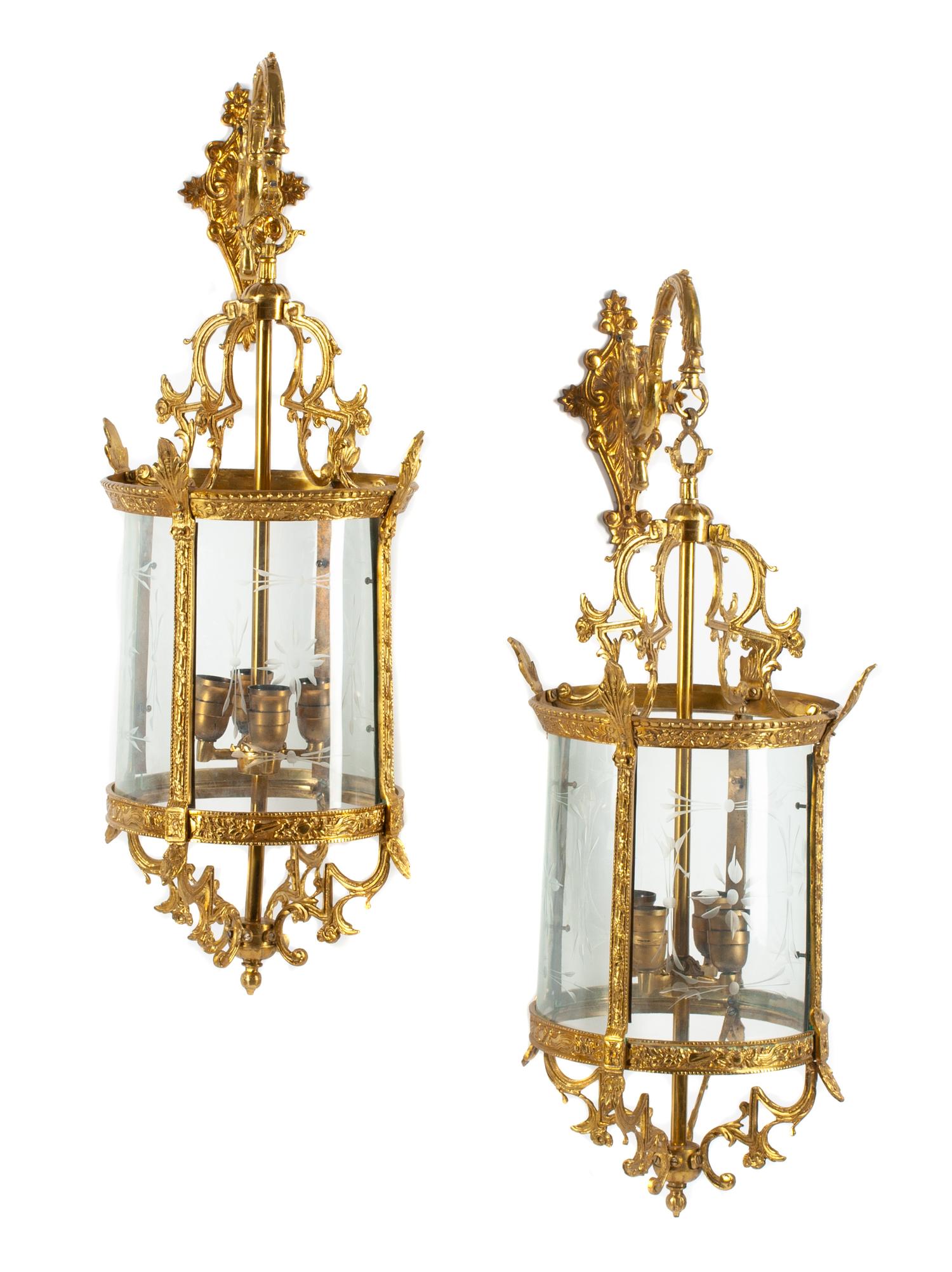 A Pair of English Gilt Bronze and Etched Glass Wall Lanterns Height 31 inches.
