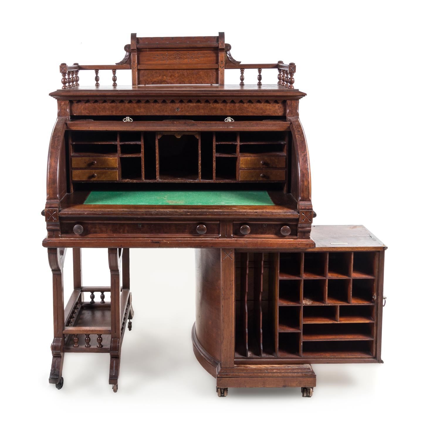 A Wooton Patent Walnut Rotary Desk Height 63 5/8 x width 45 1/2 x depth 29 3/8 inches. — SECOND HALF 19TH CENTURY