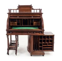 A Wooton Patent Walnut Rotary Desk Height 63 5/8 x width 45 1/2 x depth 29 3/8 inches. — SECOND HALF 19TH CENTURY