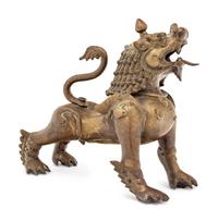 An Indian or Southeast Asian Brass Temple Lion
