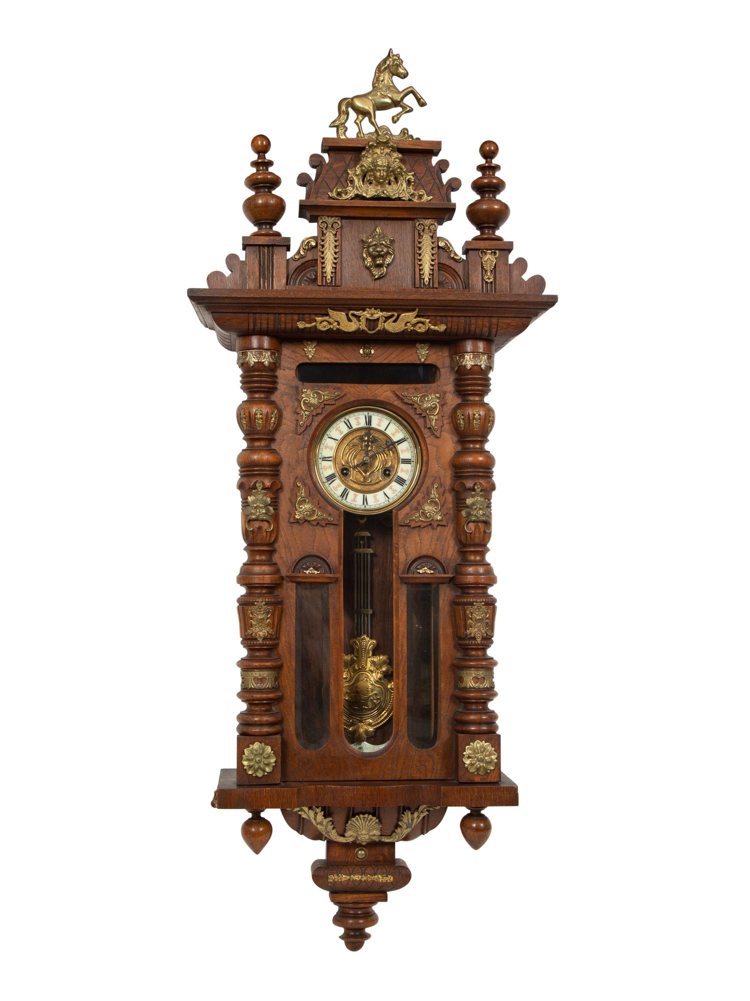 An Austrian Carved Oak Regulator Clock