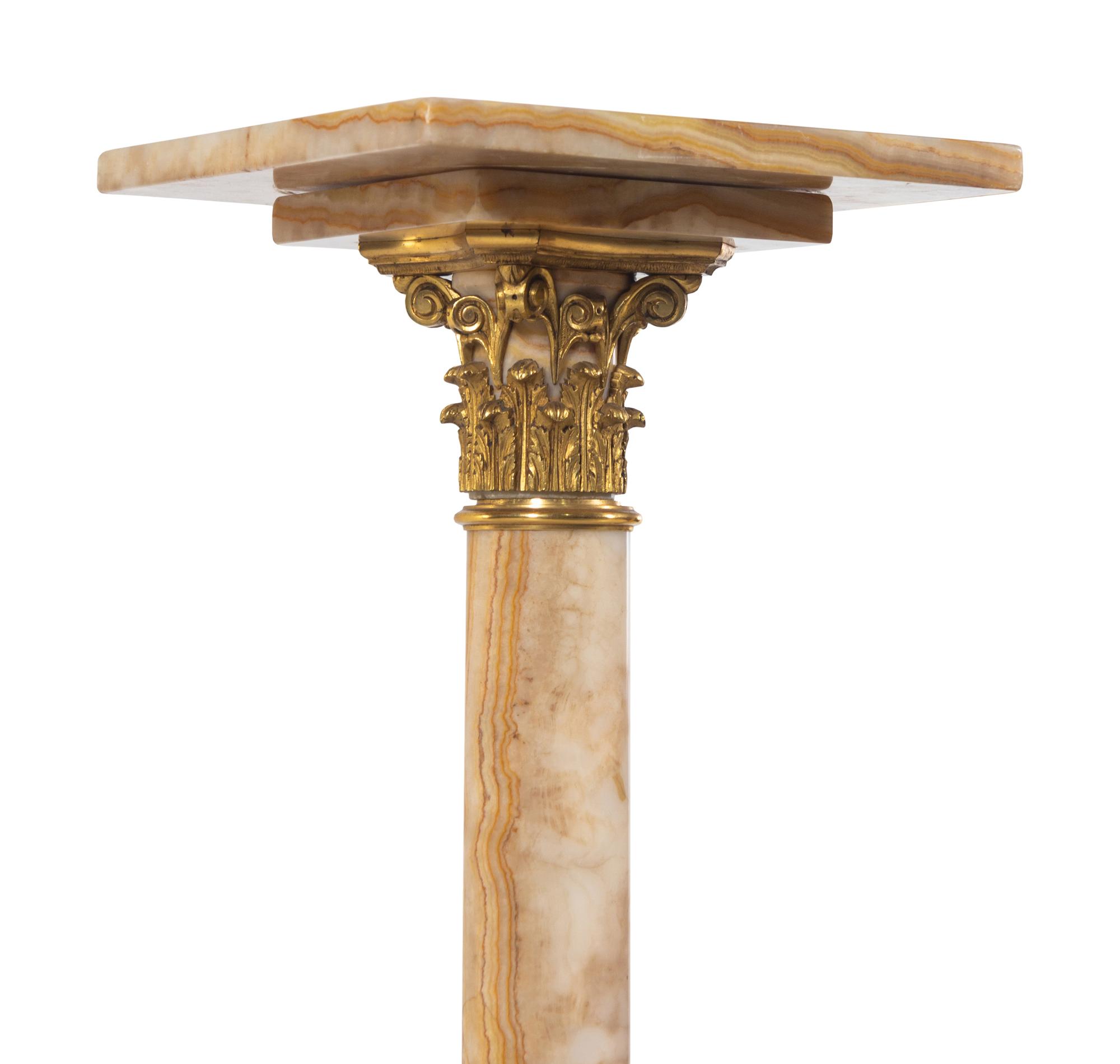 A Pair of French Gilt Bronze Mounted Onyx Pedestals