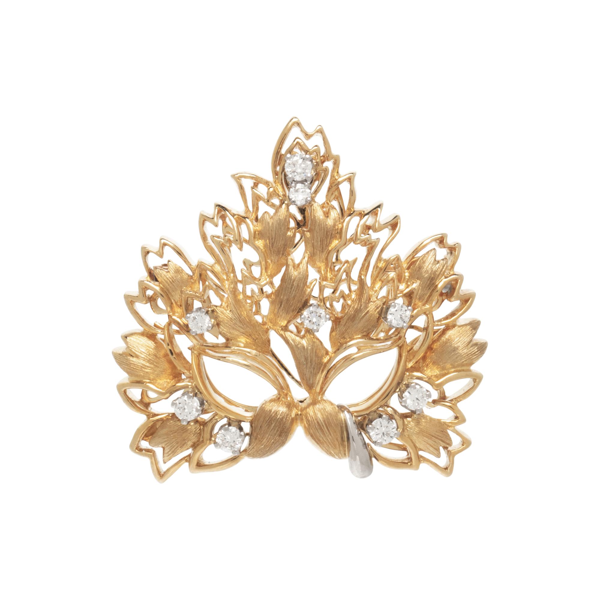 HENRY DUNAY, YELLOW GOLD AND DIAMOND MASK BROOCH