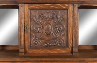 A Renaissance Revival Carved Oak Slant-Front Bureau