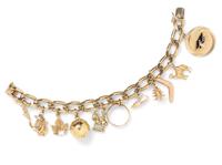 A 14 Karat Yellow Gold Charm Bracelet with 12 Attached Charms, 44.20 dwts.