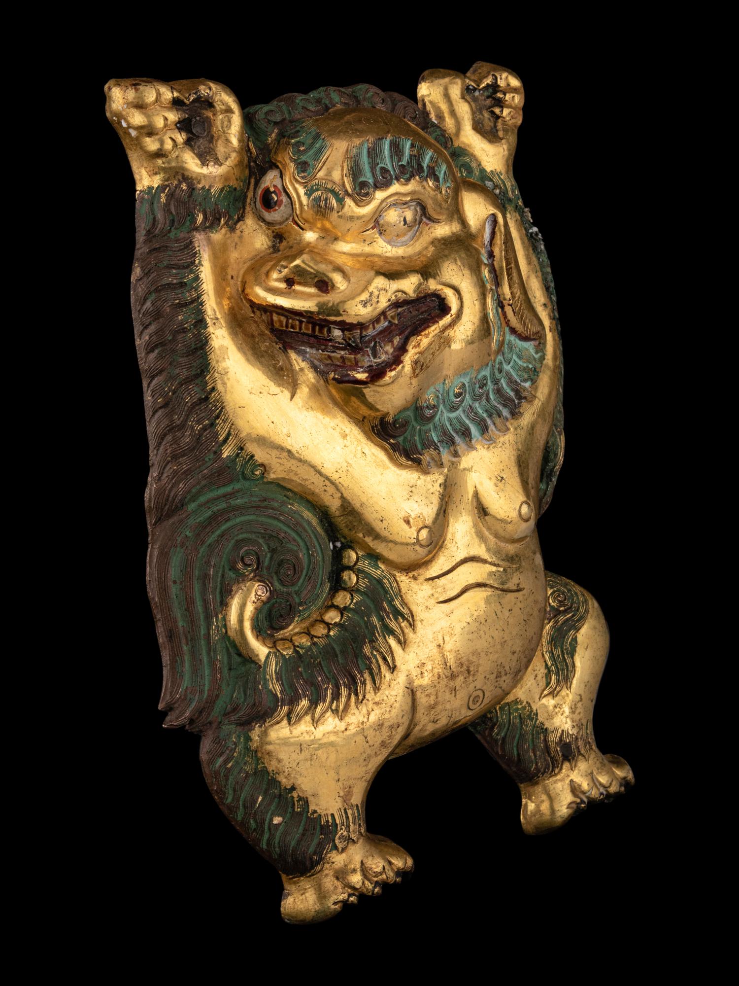 A Sino-Tibetan Gilt Bronze Repoussé Fu-Lion