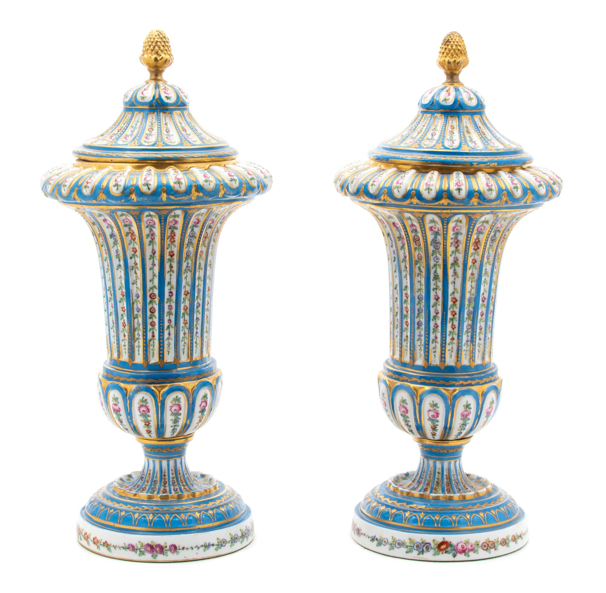A Pair of Sevres Style Porcelain Polychrome and Gilt Decorated Covered Urns Height 14 3/4 inches — 19TH CENTURY