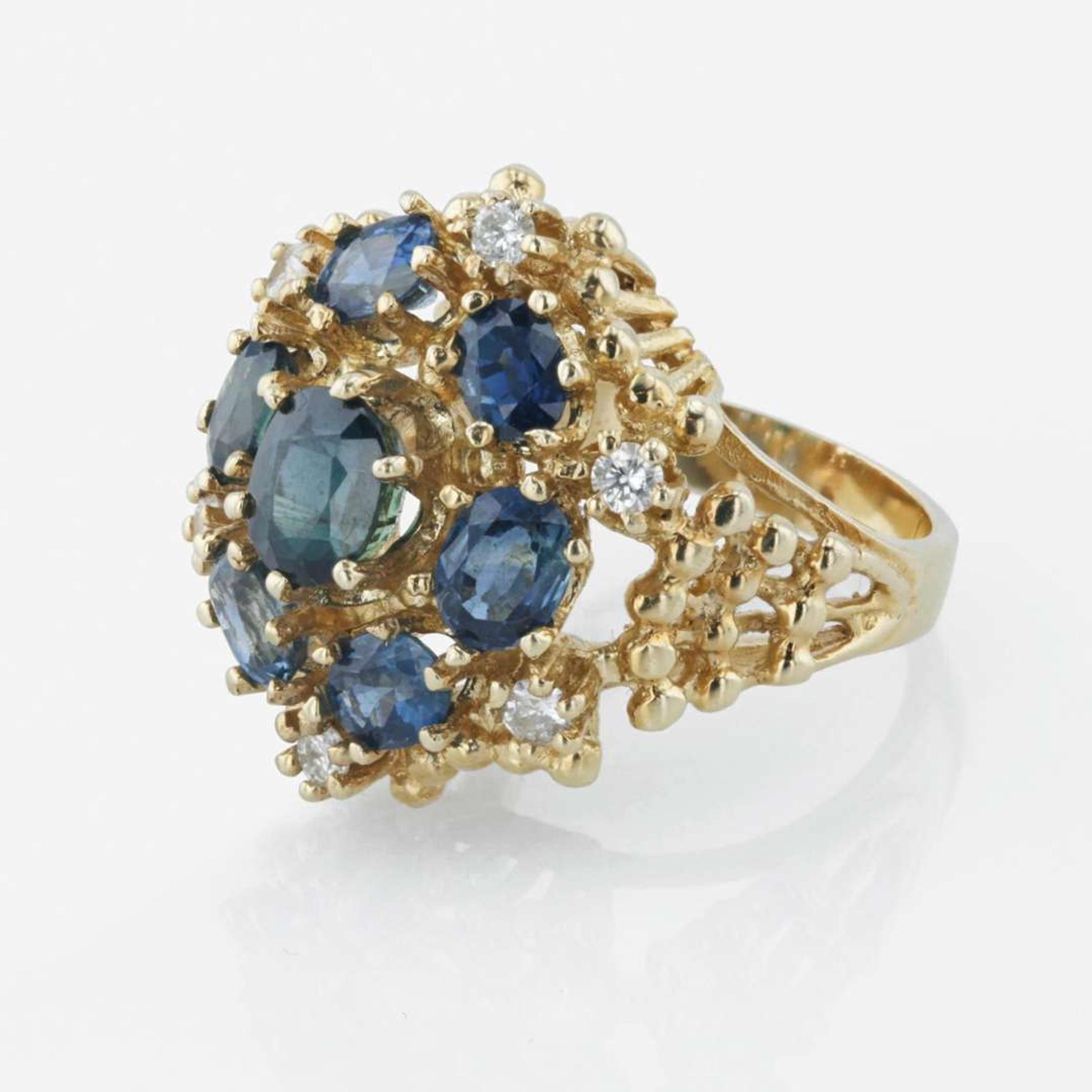 A 14K yellow gold, sapphire, and diamond ring