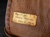 Brown Leather Drawstring Purse, with Brass Thunderbird
