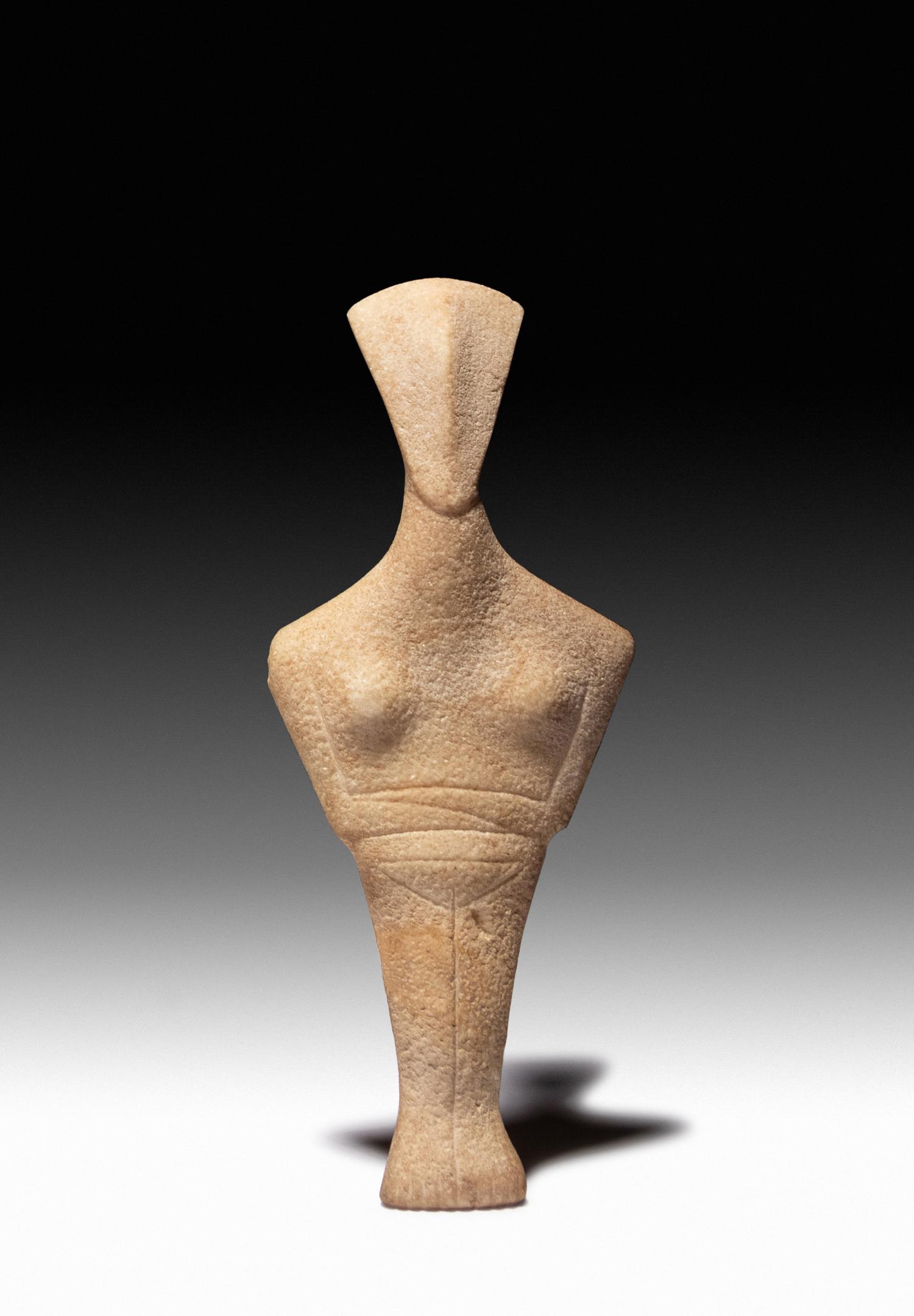 A Cycladic Marble Reclining Female Figure