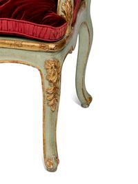 A Pair of Louis XV Green-Painted and Parcel-Gilt Cane Seat Window Benches