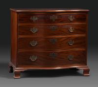 A Chippendale Figured Mahogany Serpentine Chest of Drawers