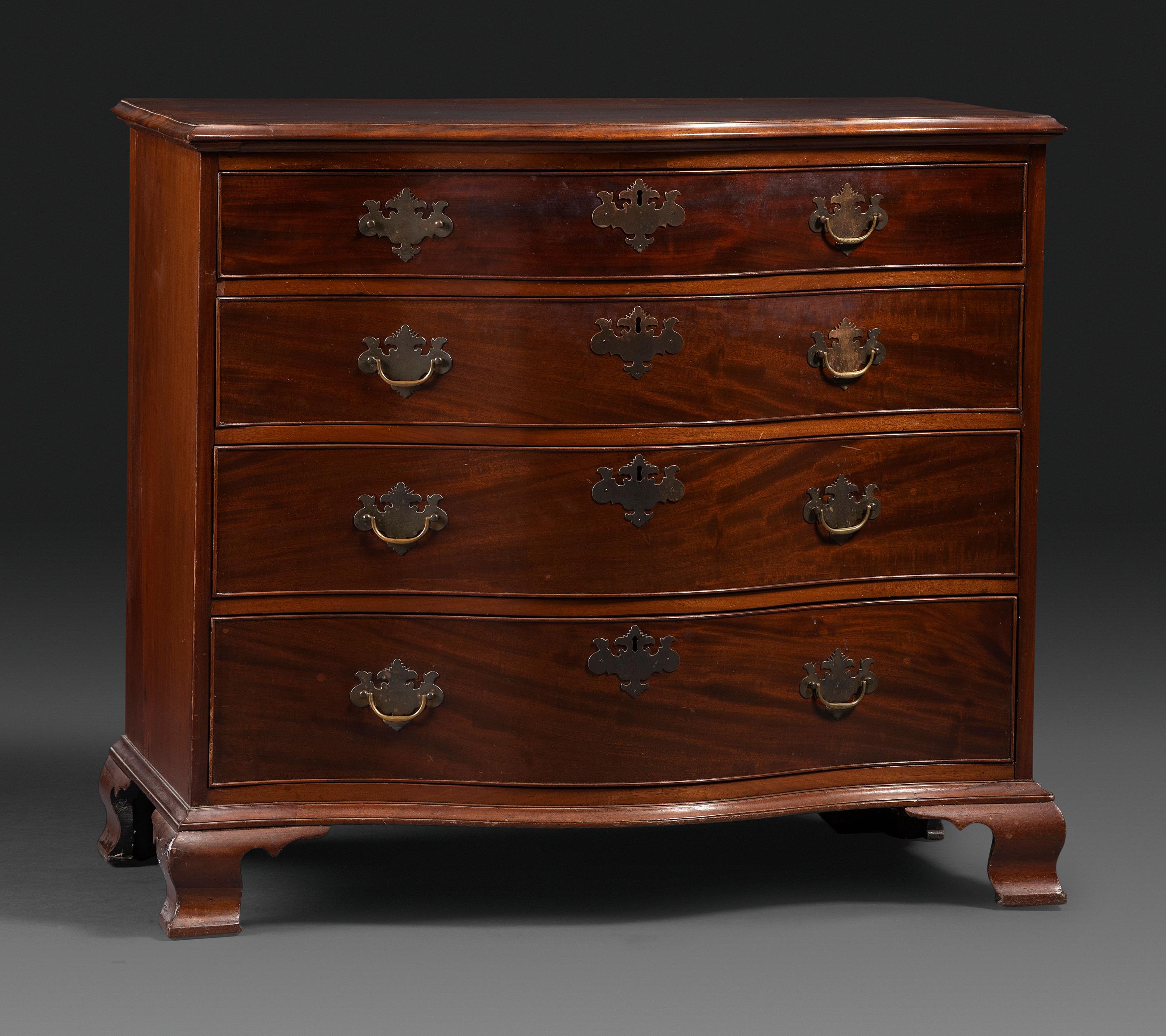 A Chippendale Figured Mahogany Serpentine Chest of Drawers