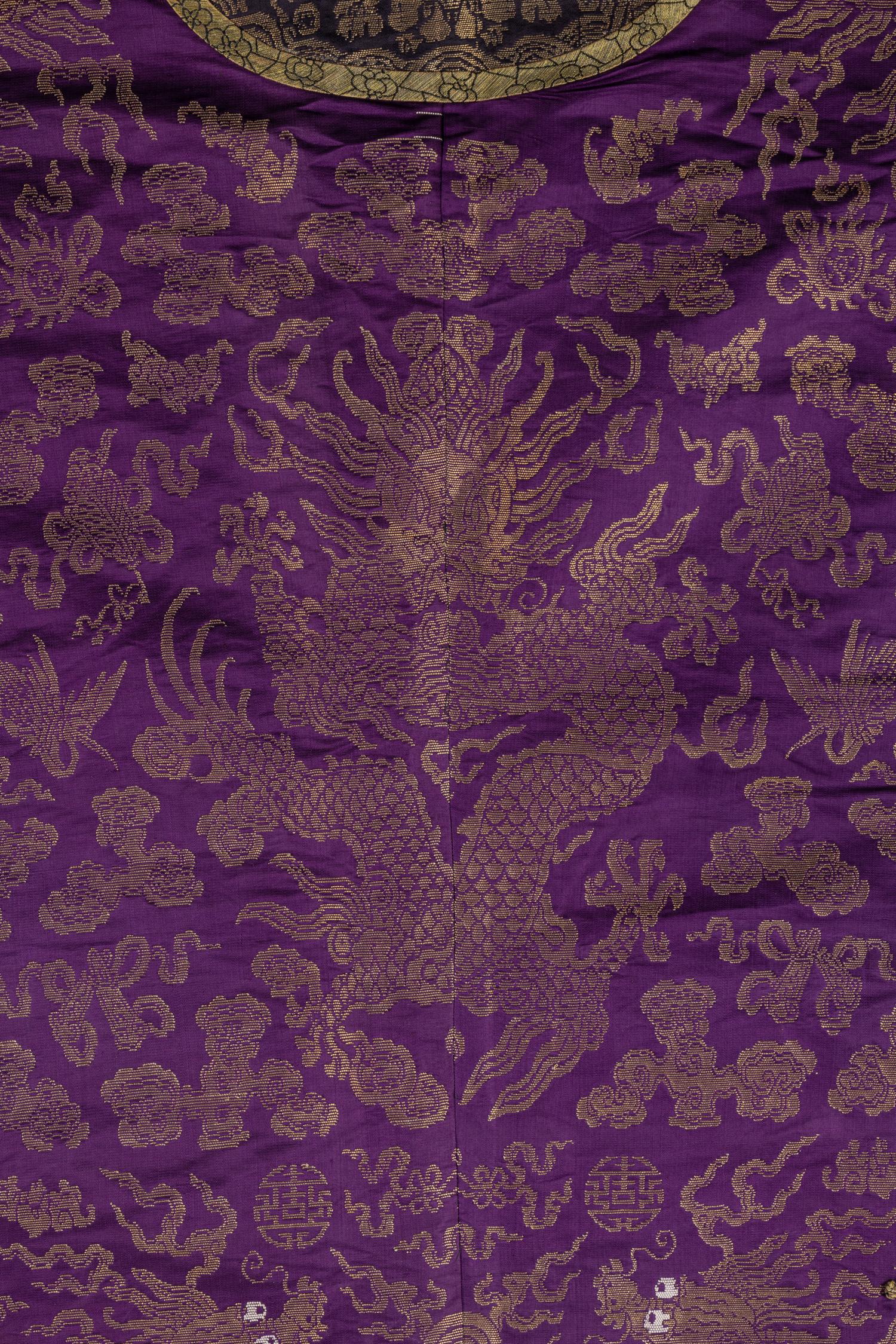 A Chinese Magenta Gold Brocade Dragon Robe