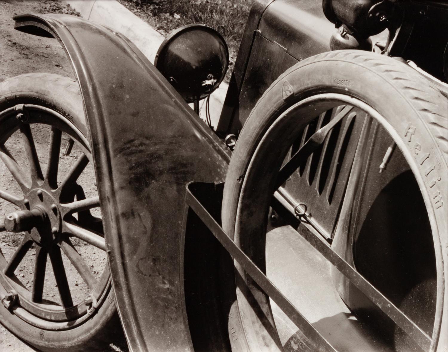 A group of three photographs ( Self Portrait with Camera , 1929 (printed 1979); Car Wheel, Ford, 1929 (printed 1980); Saratoga Coal , 1929 (printed 1981))