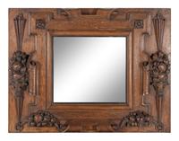 A Continental Carved Oak Mirror