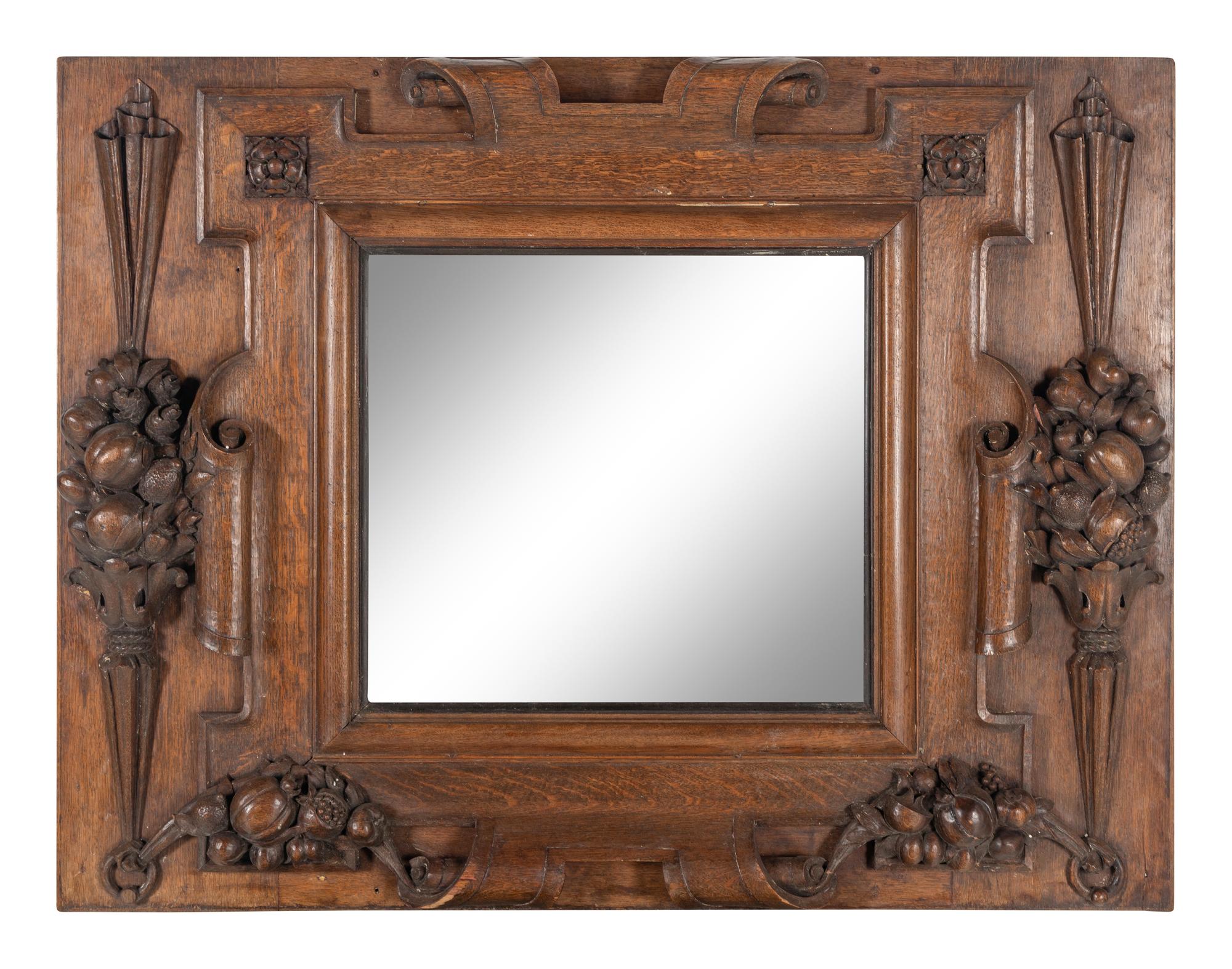 A Continental Carved Oak Mirror