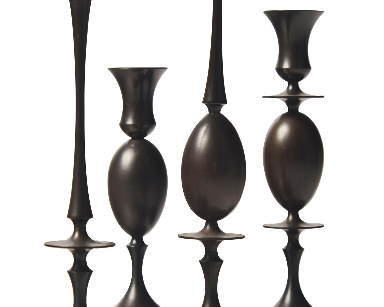 Group of 5 bronze candlesticks