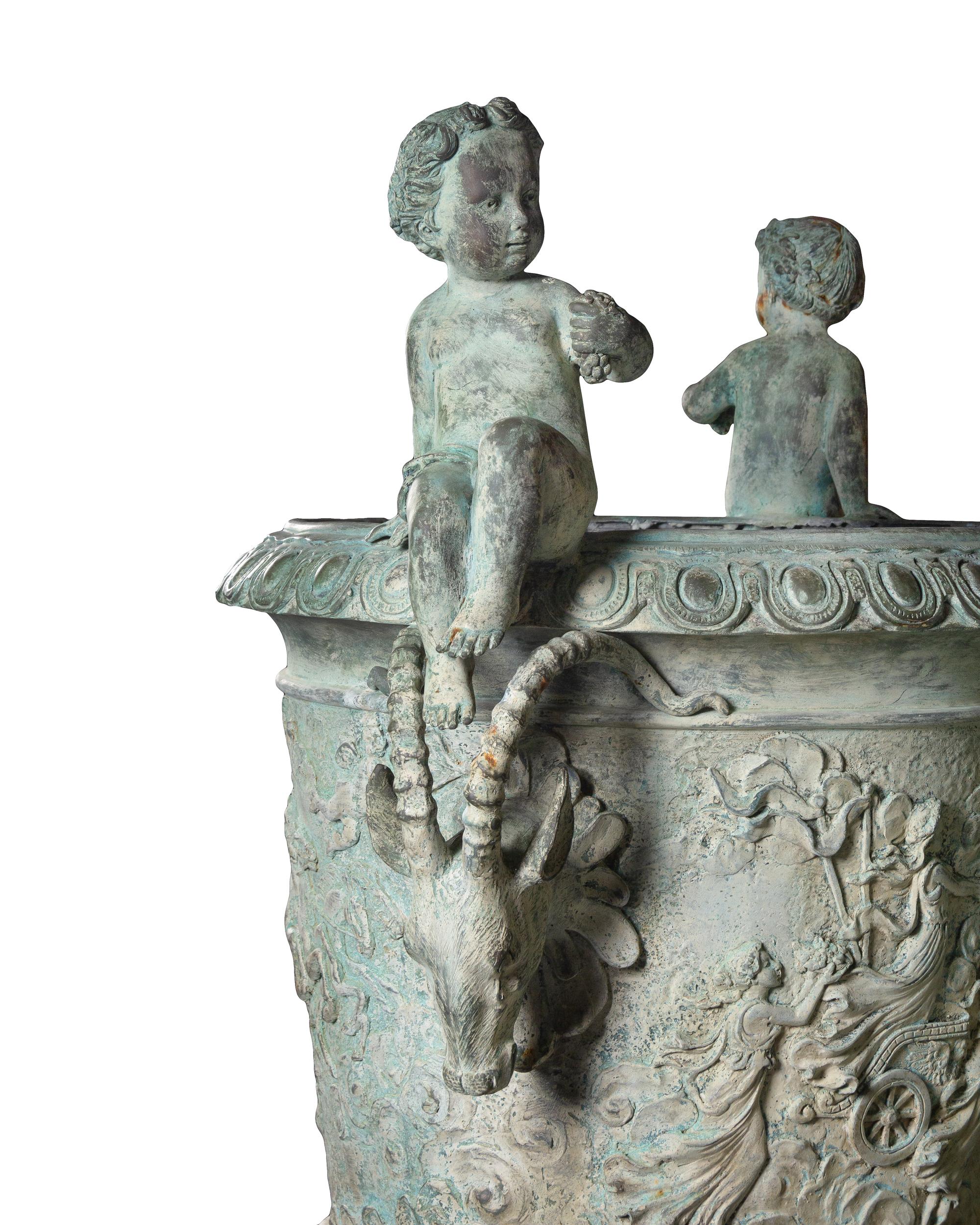A Pair of Neoclassic Style Patinated Bronze Garden Urns and a Fountain