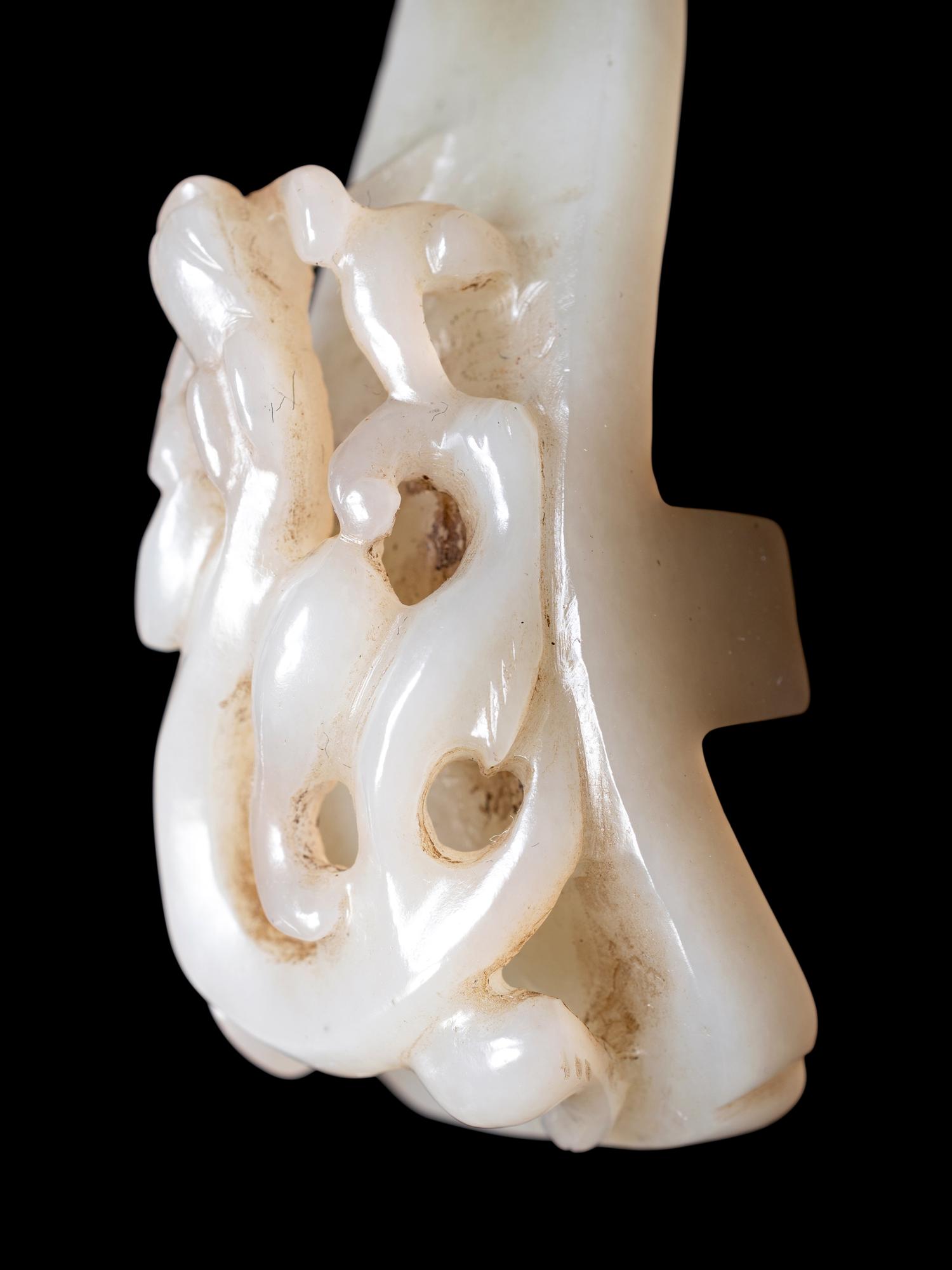 Two Chinese Celadon and Russet Jade Articles