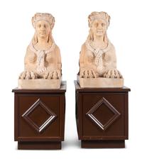 A Pair of Large Composite Marble Sphinxes