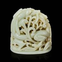 A Chinese pale celadon jade reticulated "Dragon" finial 青白玉镂空龙形炉端