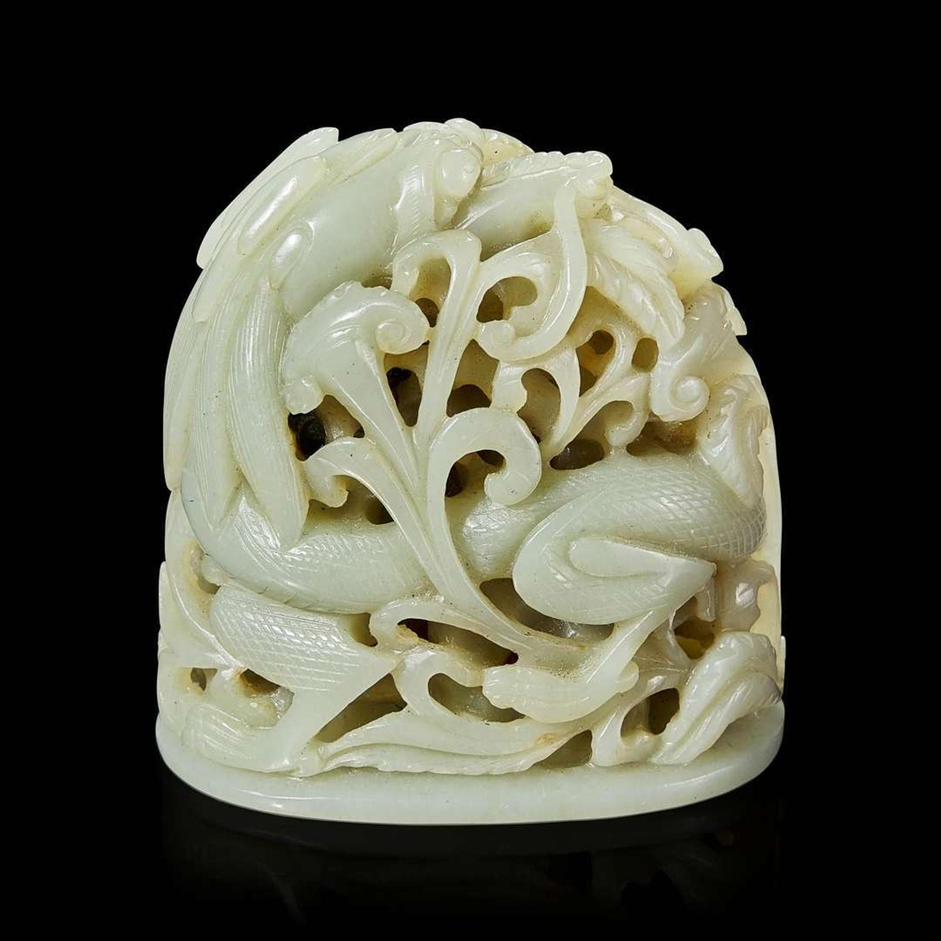 A Chinese pale celadon jade reticulated "Dragon" finial 青白玉镂空龙形炉端