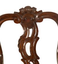 A Suite of Fourteen Italian Baroque Style Walnut Dining Chairs — 19th Century
