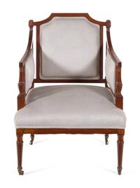A Regency Style Carved and Inlaid Mahogany Armchair