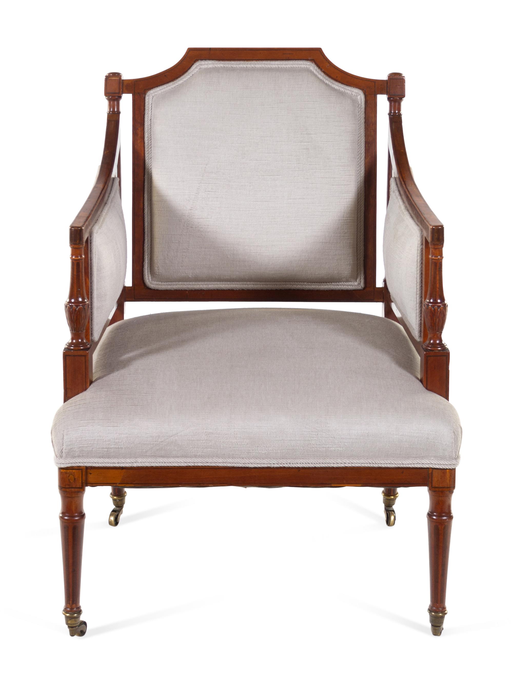 A Regency Style Carved and Inlaid Mahogany Armchair