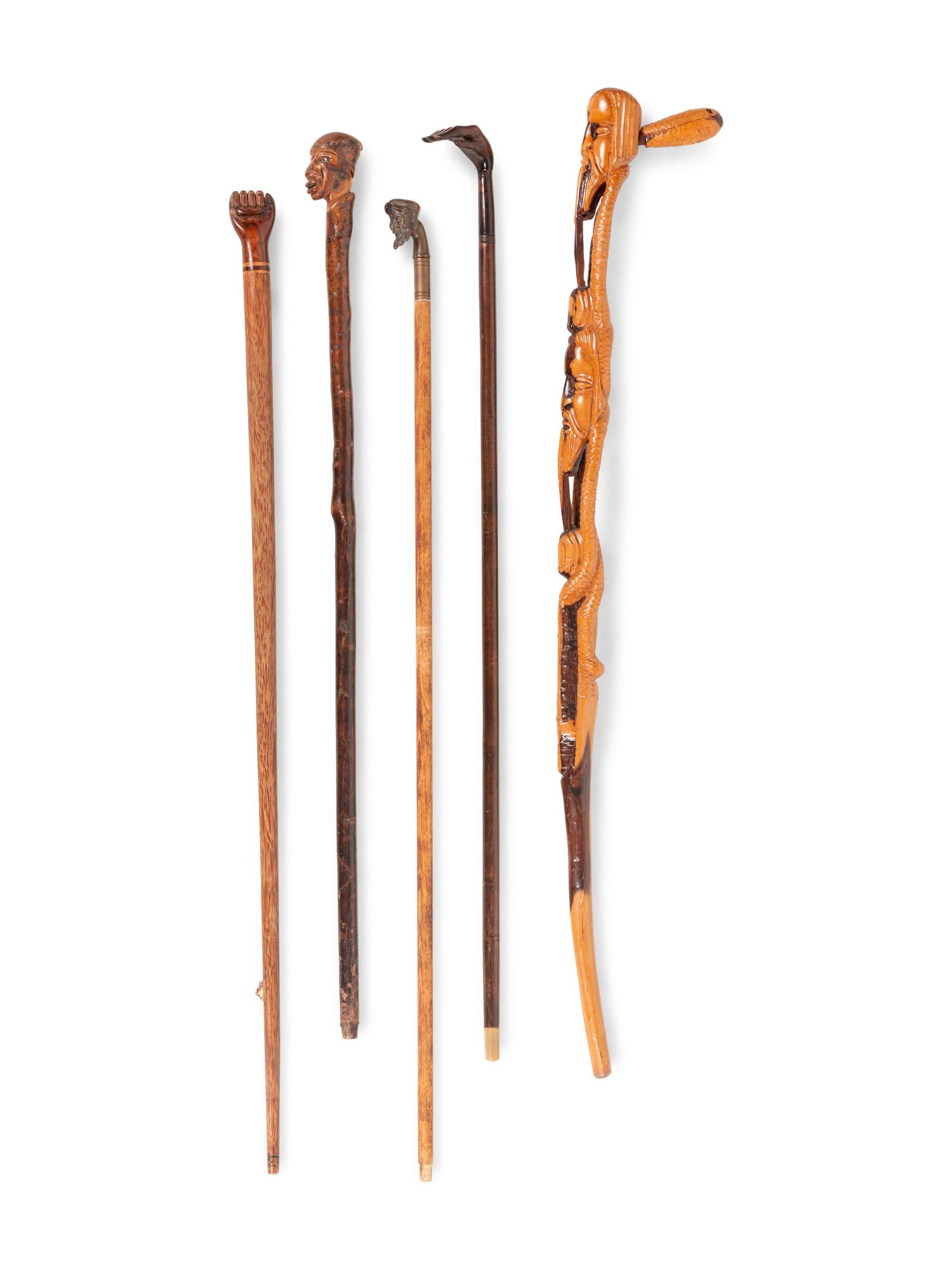 Five Carved and Mixed Metal Figural Canes and Walking Sticks