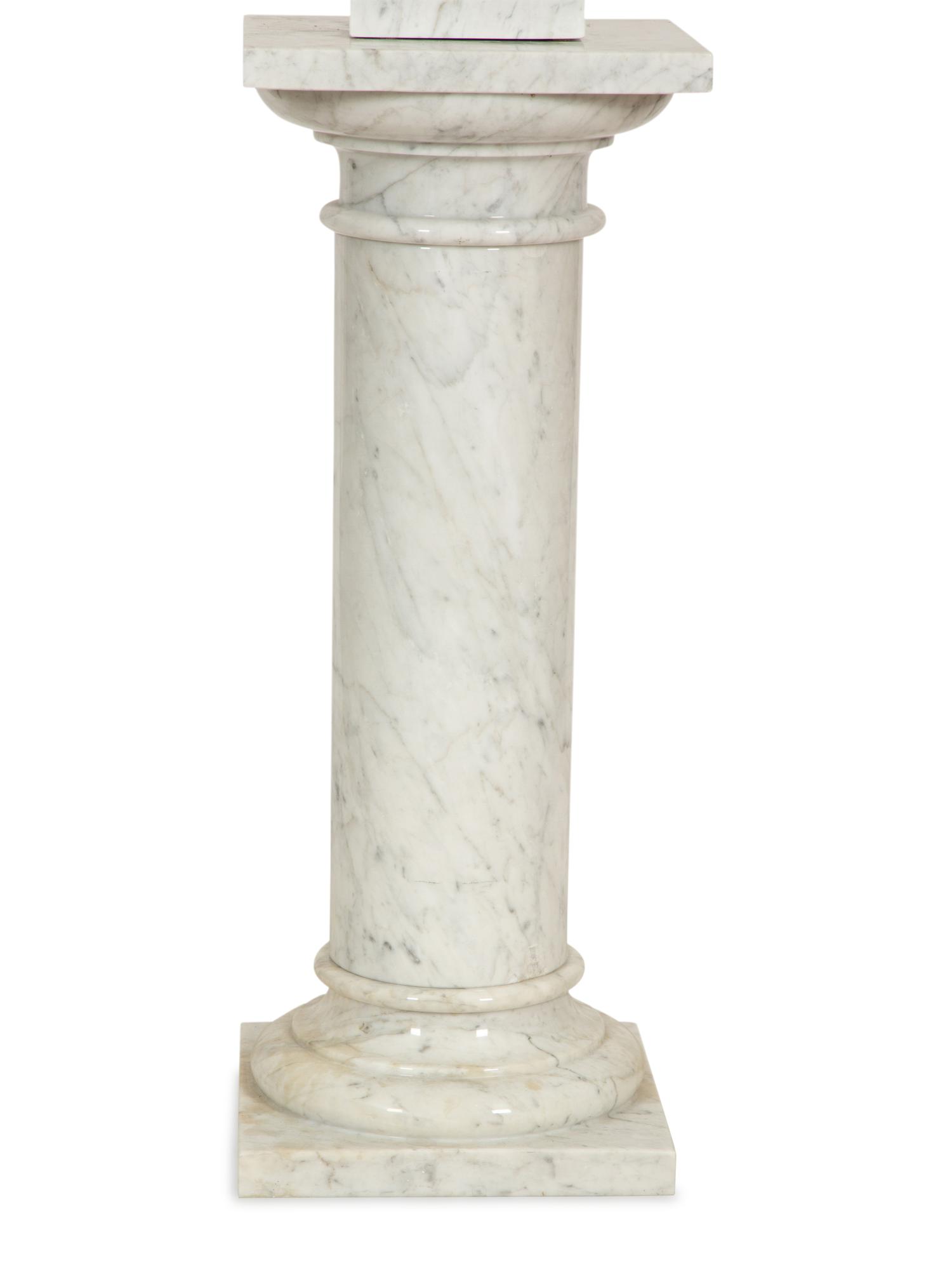 A Pair of White Marble Urns on Matching Pedestals