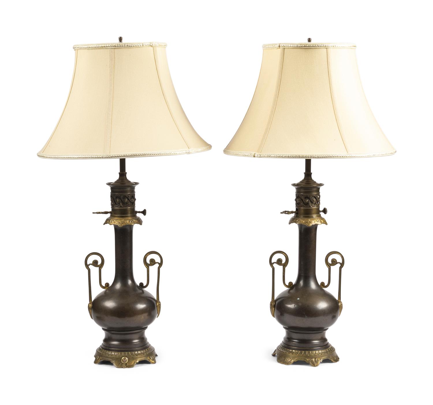 A Pair of French Gilt and Patinated Cast Metal Table Lamps