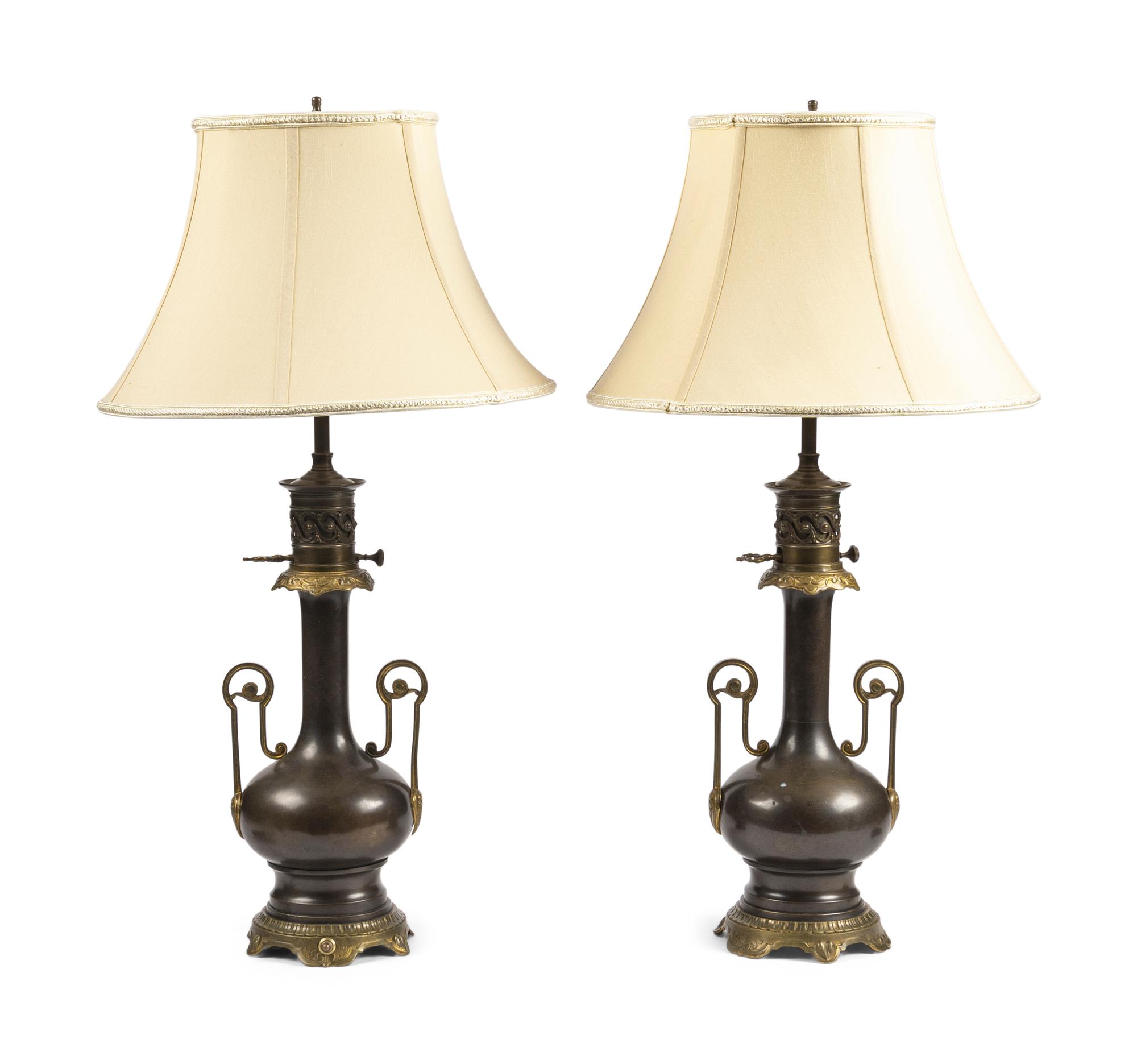 A Pair of French Gilt and Patinated Cast Metal Table Lamps