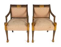 A Pair of Egyptian Revival Parcel-Gilt Mahogany Armchairs — EARLY 20TH CENTURY