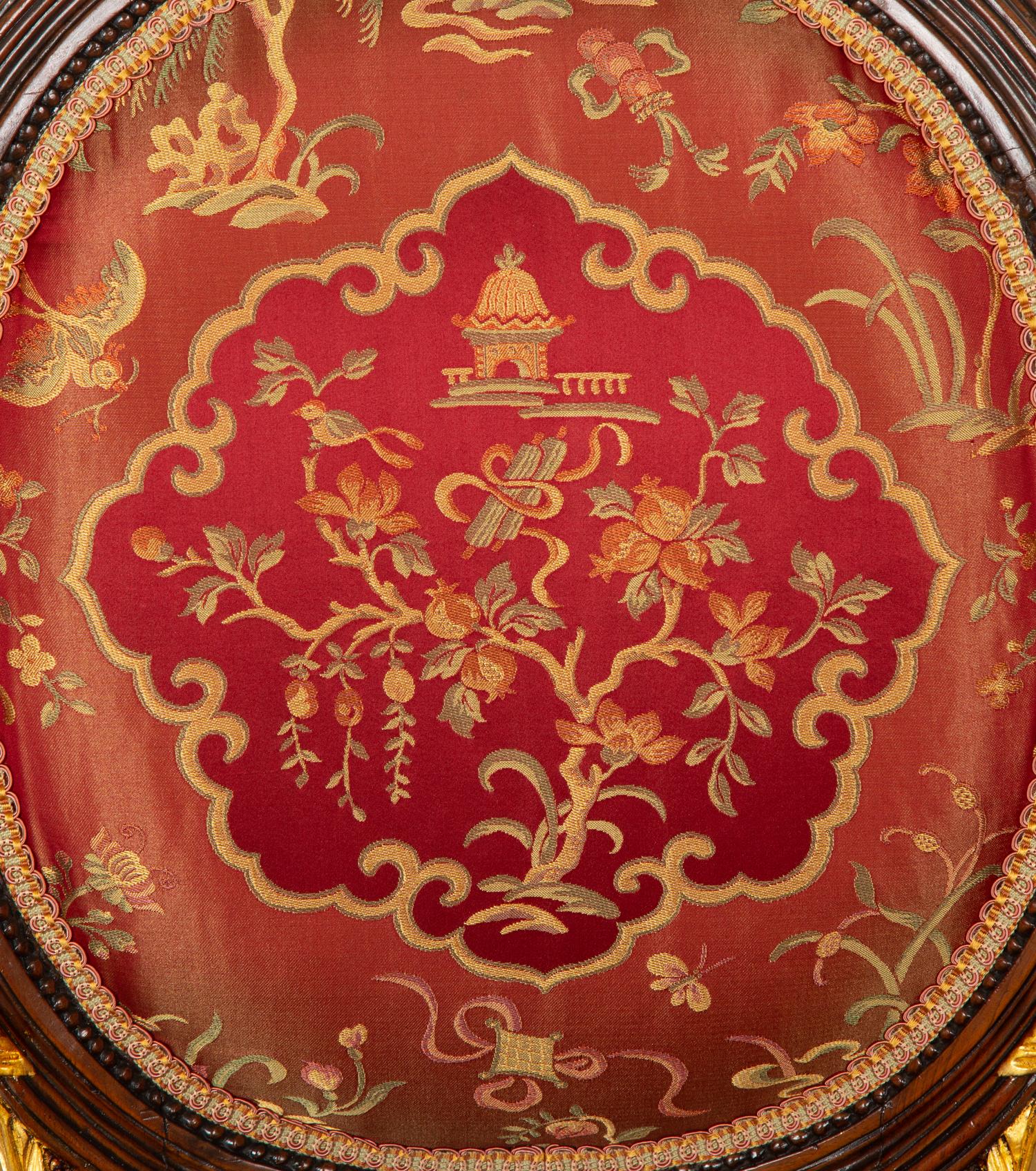 A Pair of Louis XVI Style Stained and Gilt Mahogany Side Chairs.