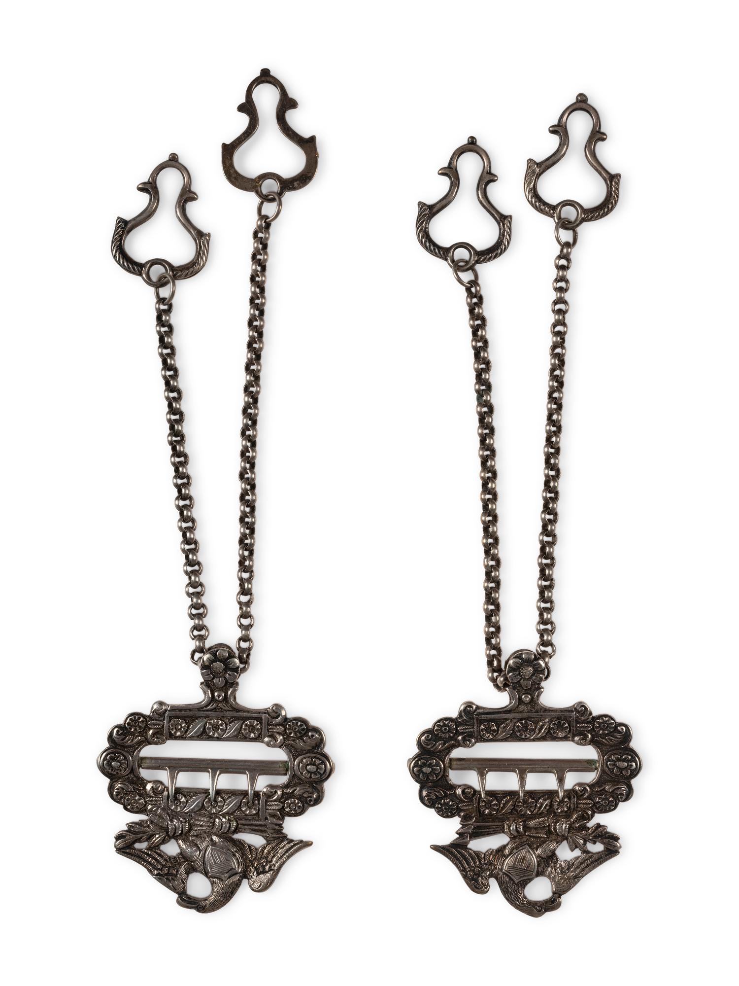 Silver eagle suspender buckles.