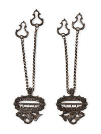 Silver eagle suspender buckles.