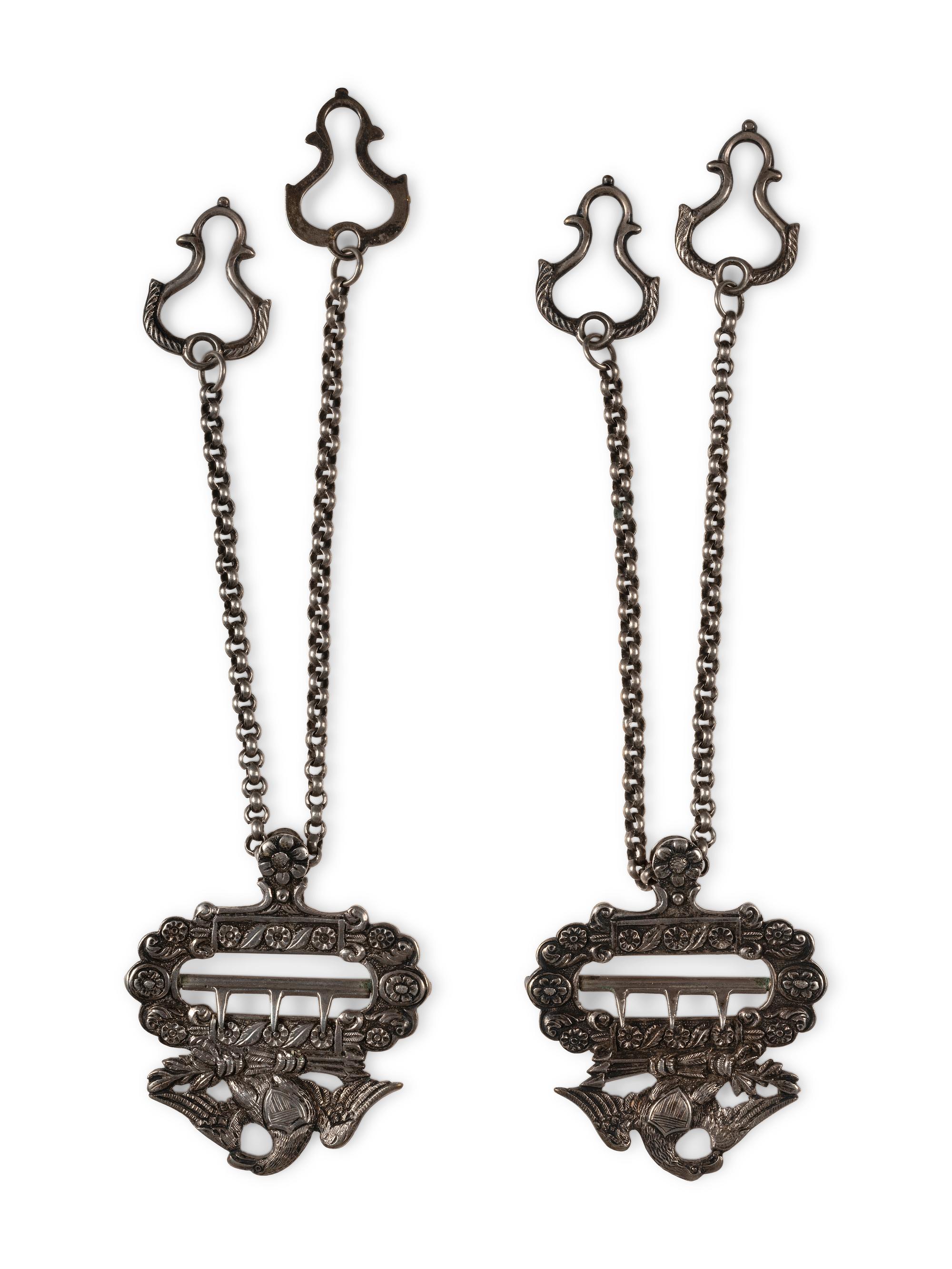 Silver eagle suspender buckles.