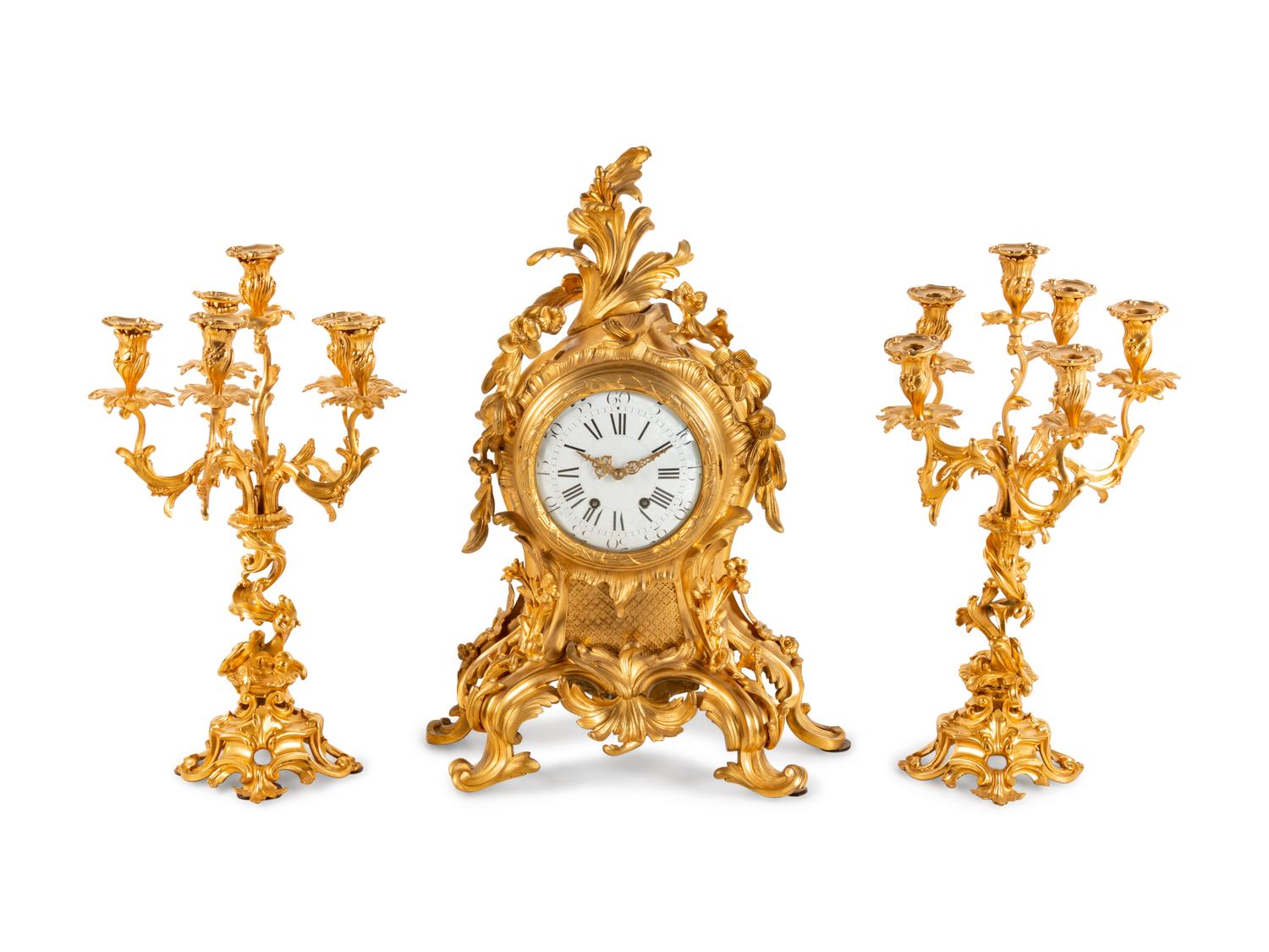 A Louis XV Style Gilt Bronze Clock Garniture