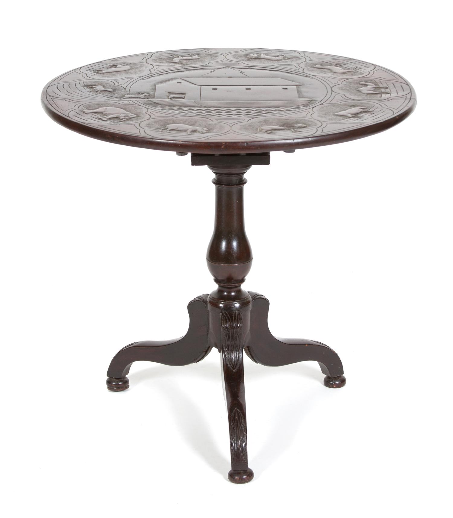 A British Colonial Carved Mahogany Tripod Table Height 28 1/2 x diameter 29 inches. — 19TH CENTURY