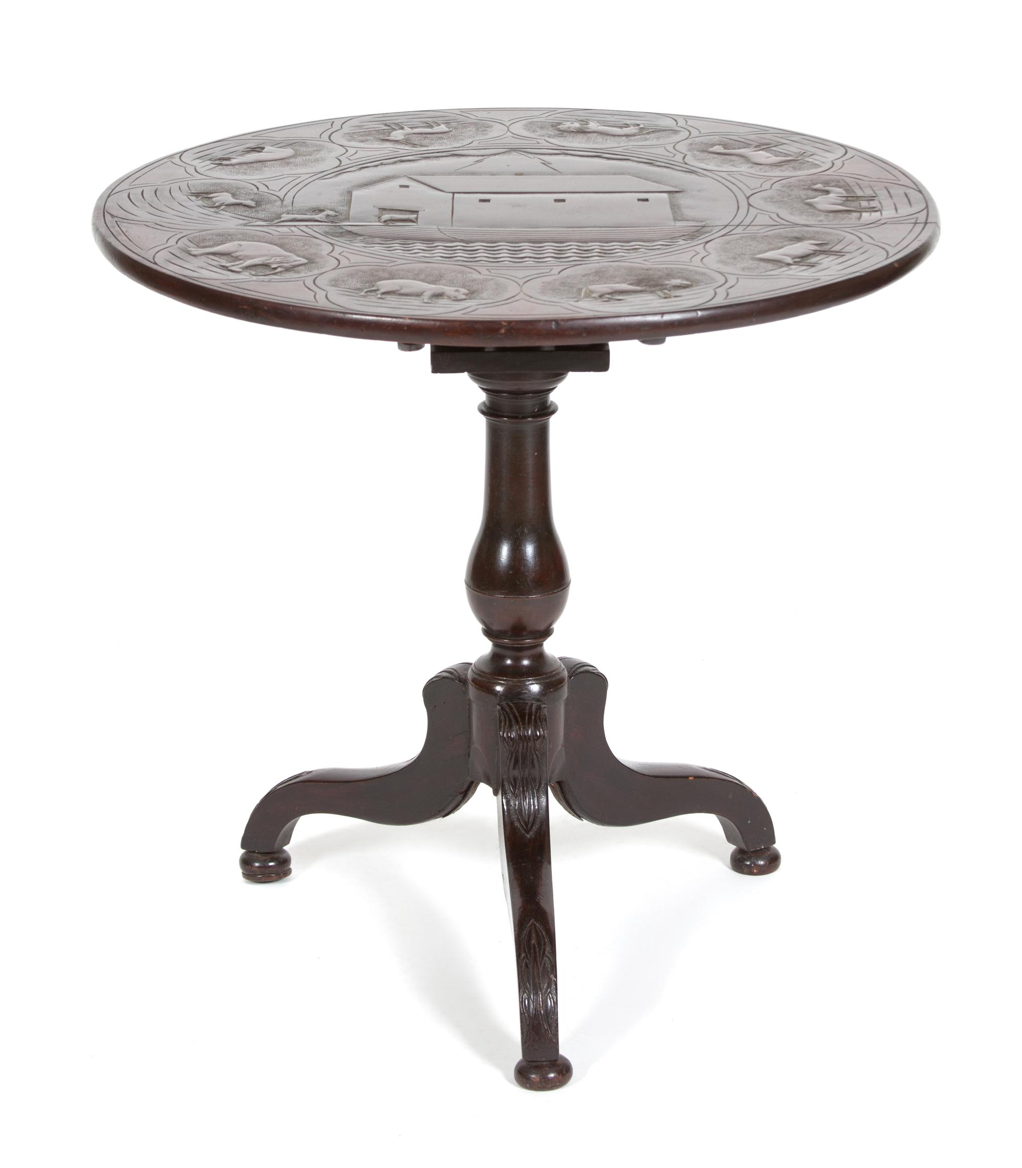 A British Colonial Carved Mahogany Tripod Table Height 28 1/2 x diameter 29 inches. — 19TH CENTURY