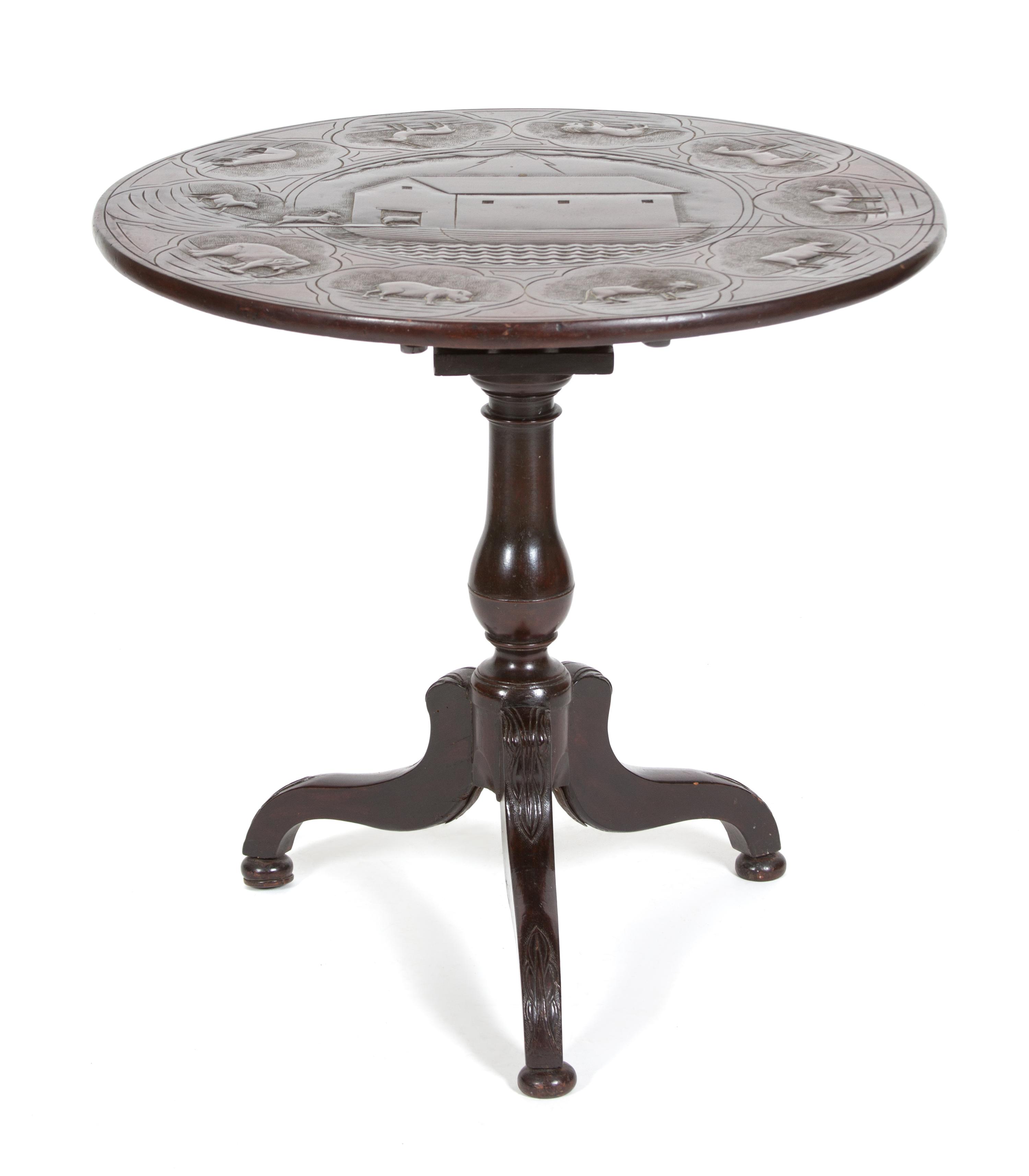 A British Colonial Carved Mahogany Tripod Table Height 28 1/2 x diameter 29 inches. — 19TH CENTURY